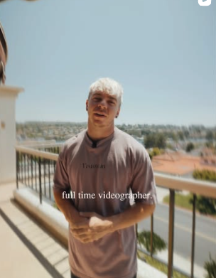 Chance, co-founder of Ophir Scales and filmmaker, standing on a balcony